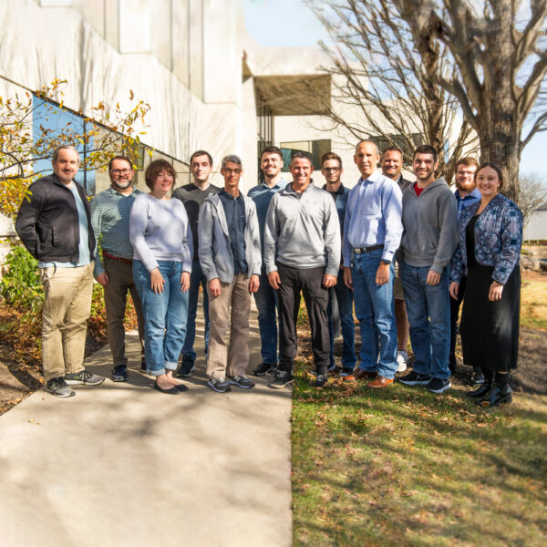 The Jumpmind team stands as a group outside their office on a beautiful Fall day in Columbus, Ohio