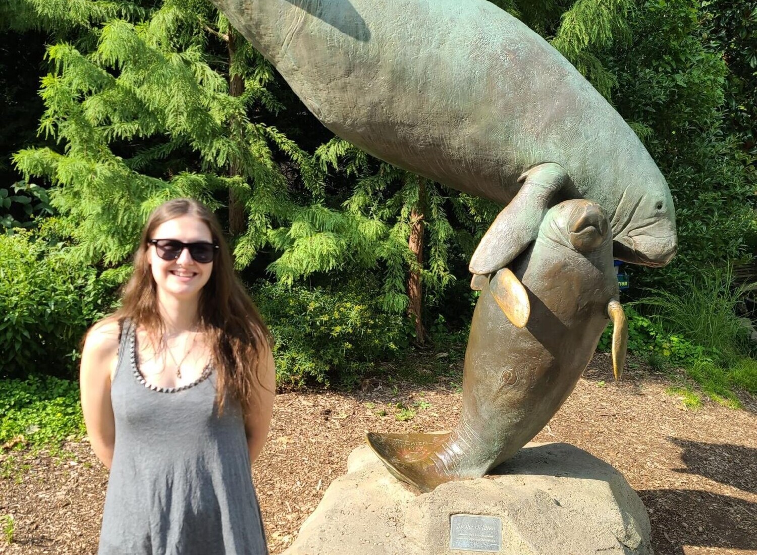 Rachel Albers with a manatee statue